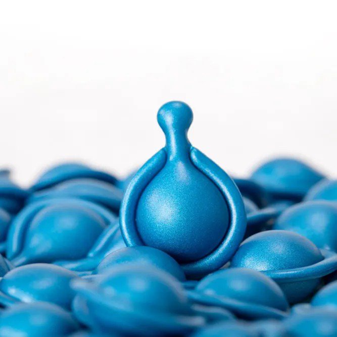 Teal Blue Metallic Capsule Macro Shot | OEM/ODM Beauty Maker